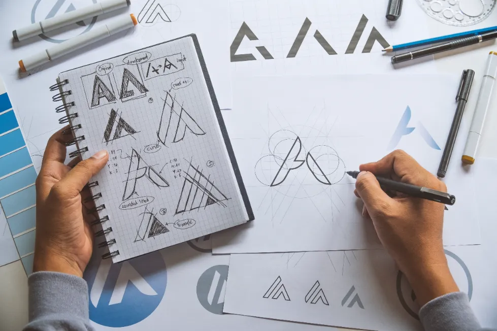 someone sketching out ideas for branding