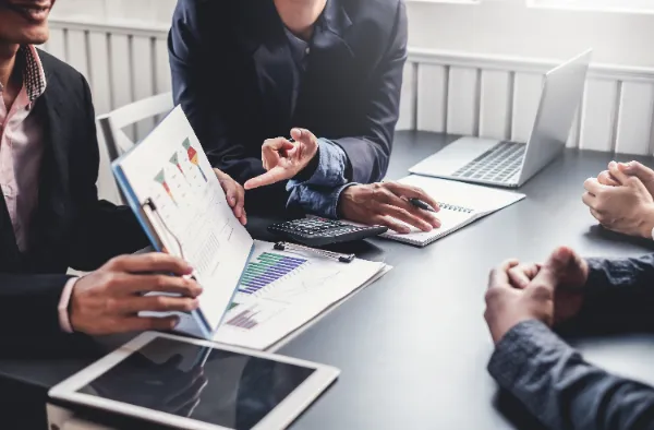 a group of people reviewing business performance at a table