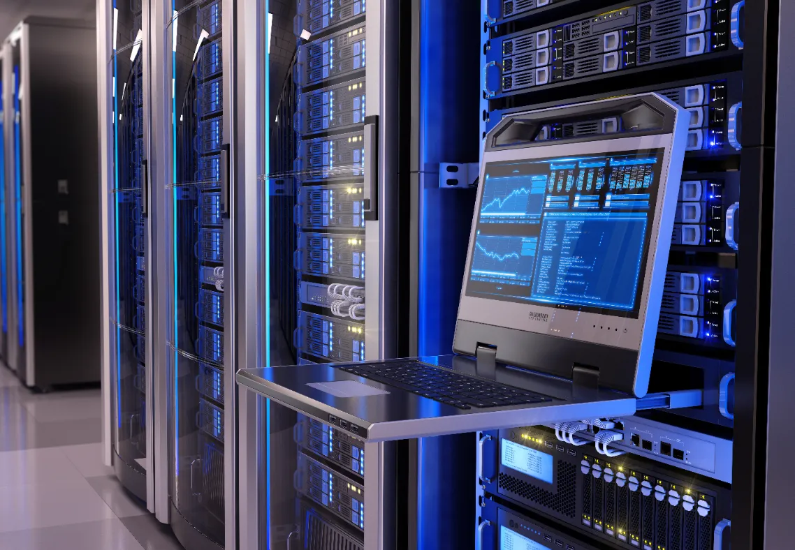 an image of a laptop in front of a row of servers in a datacenter