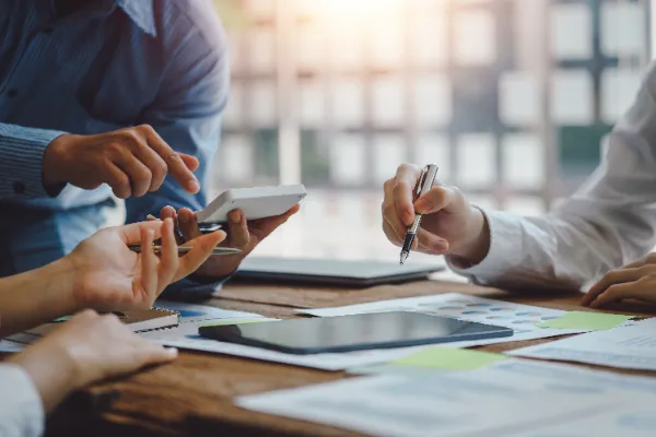 a group of people reviewing business performance at a table