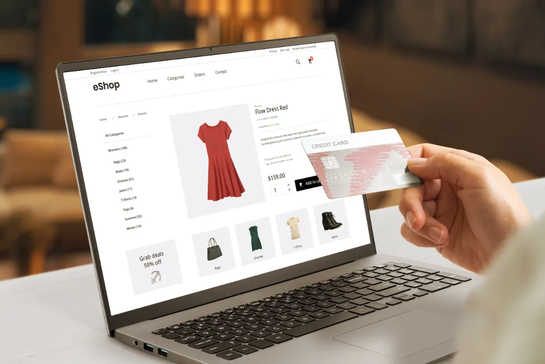 someone using their credit card to buy something from an online shop
